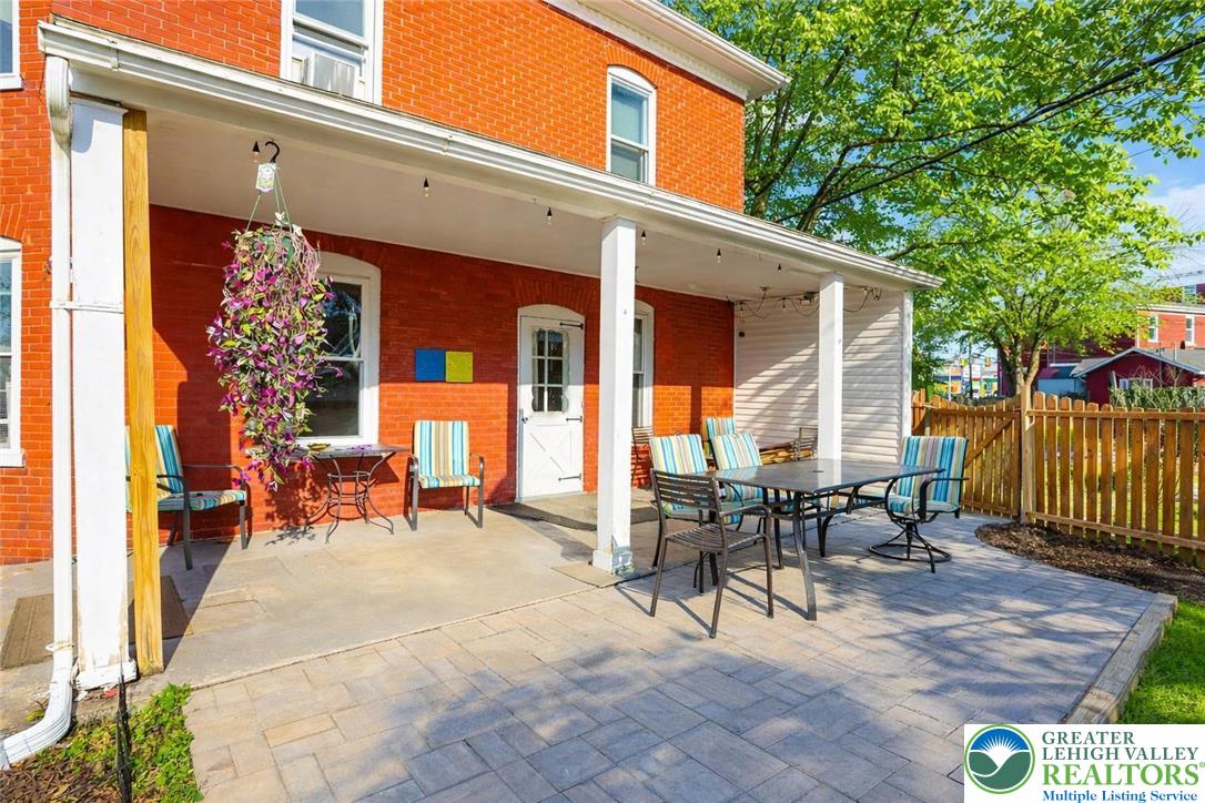 225 South Walnut Street Bath, PA 18014 - Photo 17 of 20 a view of a patio with table and chairs and wooden fence