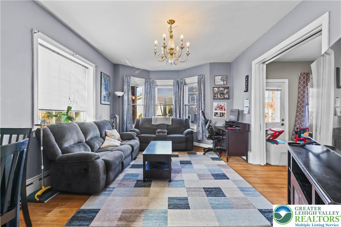 225 South Walnut Street Bath, PA 18014 - Photo 9 of 20 a living room with furniture and a chandelier