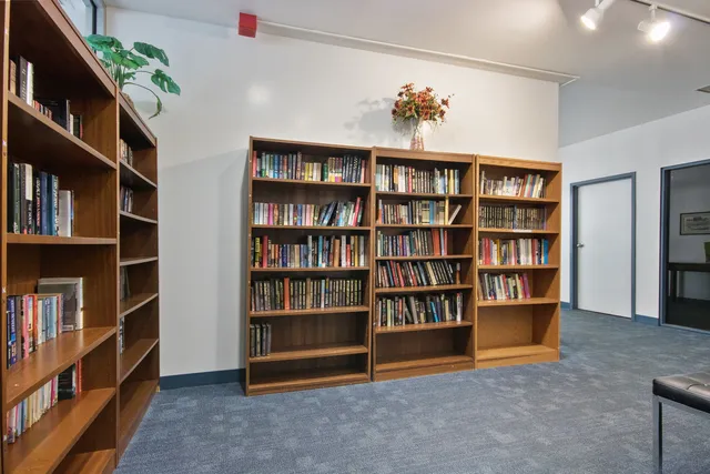 a view of room with furniture and book shelf