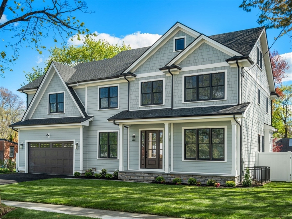 12 Sylvester Road Newton, MA 02465 - Photo 1 of 17 a front view of a house with a yard