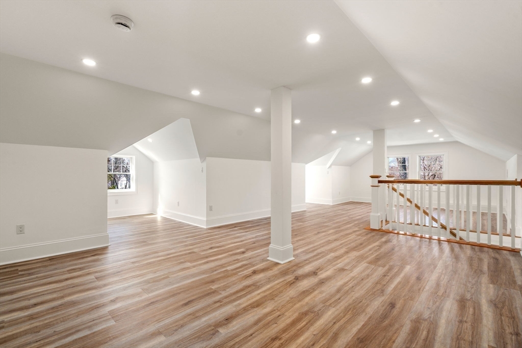 12 Sylvester Road Newton, MA 02465 - Photo 13 of 17 a view of a big room with wooden floor and windows