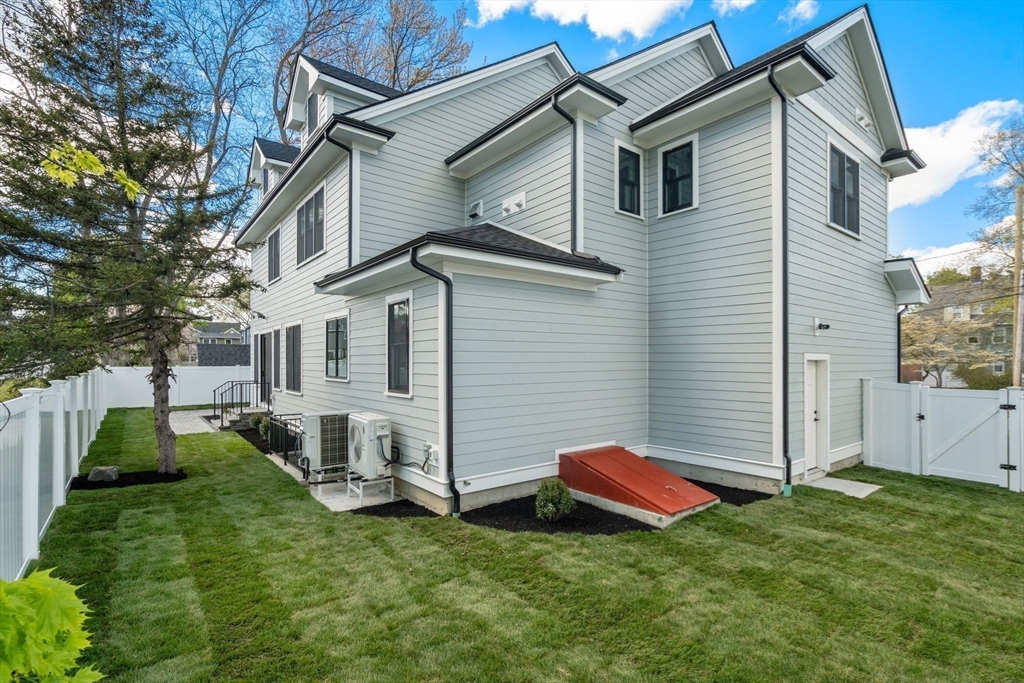 12 Sylvester Road Newton, MA 02465 - Photo 16 of 17 a view of a white house in front of a big yard