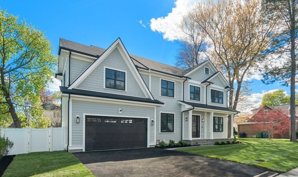 12 Sylvester Road Newton, MA 02465 - Photo 17 of 17 a front view of a house with a yard and garage