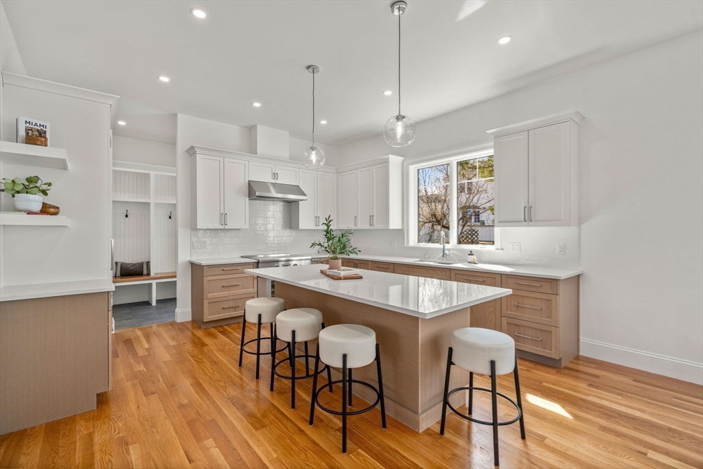 12 Sylvester Road Newton, MA 02465 - Photo 3 of 17 a large kitchen with a table and chairs in it