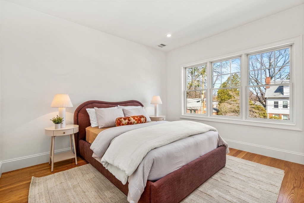 12 Sylvester Road Newton, MA 02465 - Photo 8 of 17 a bedroom with a bed and a large window
