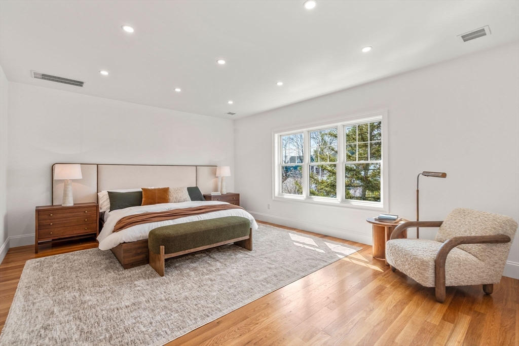 12 Sylvester Road Newton, MA 02465 - Photo 10 of 17 a spacious bedroom with a bed and a couch