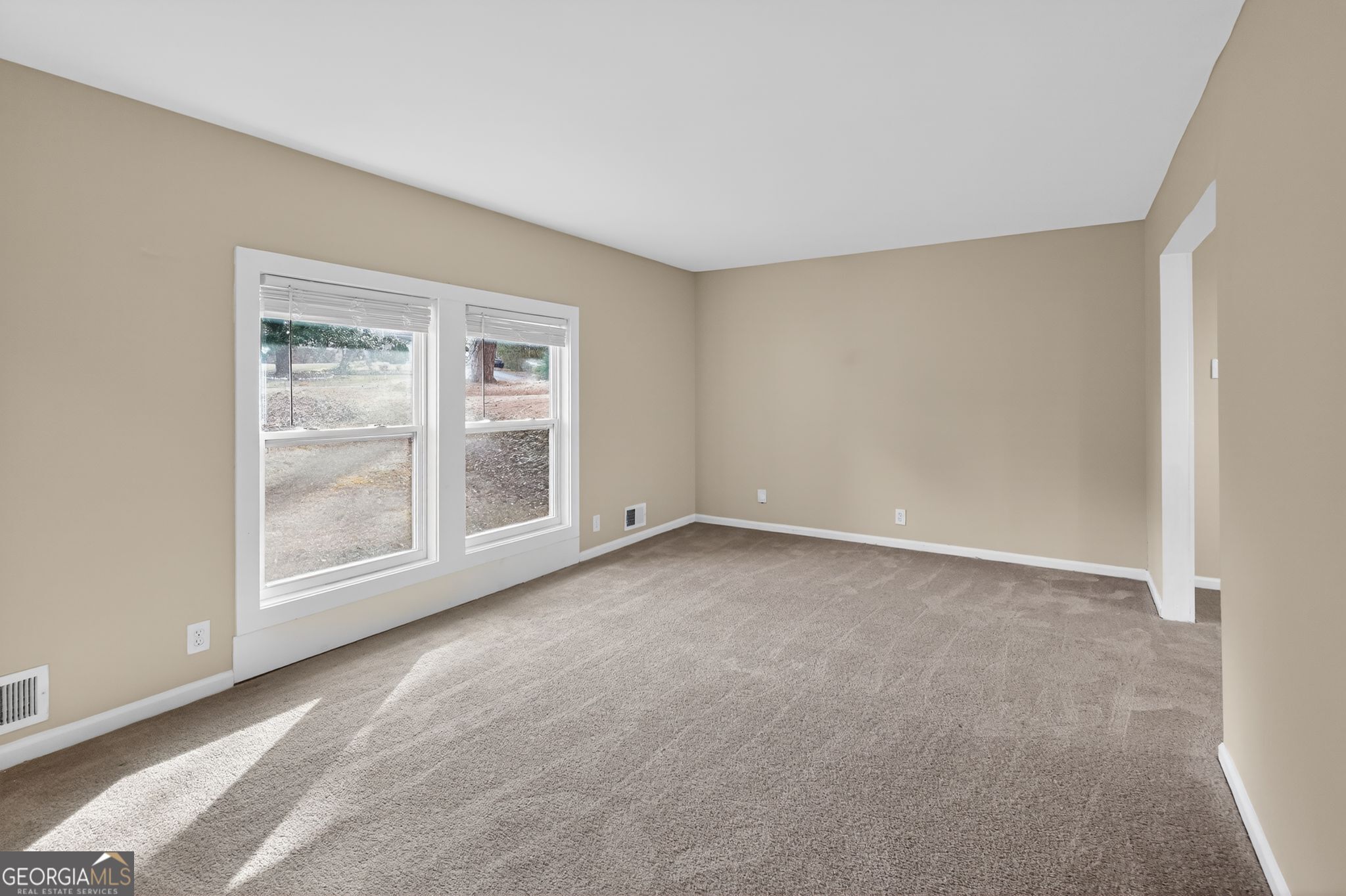 2897 Leisure Woods Lane Decatur, GA 30034 - Photo 11 of 32 a view of an empty room with a window