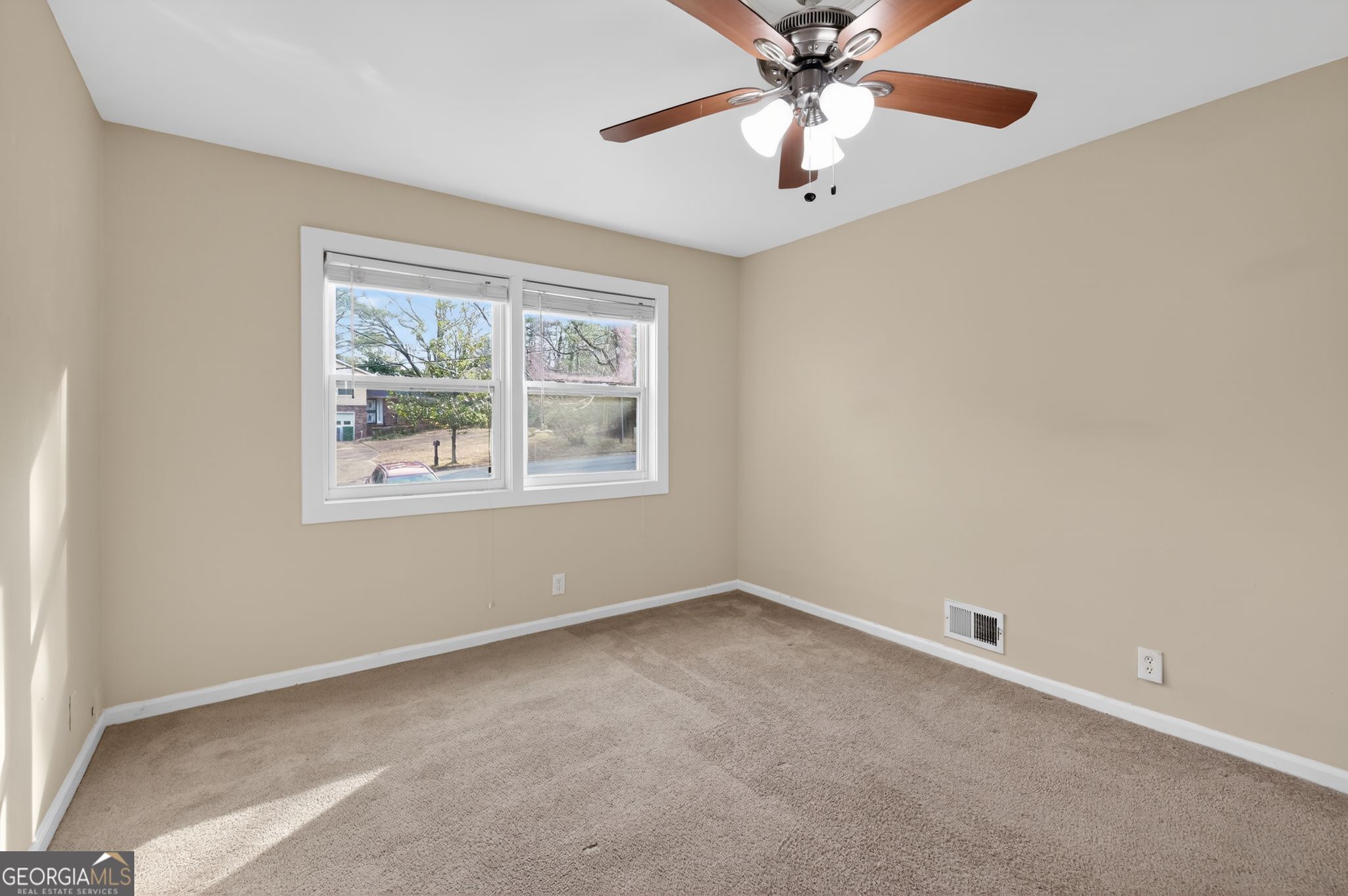 2897 Leisure Woods Lane Decatur, GA 30034 - Photo 13 of 32 an empty room with windows and fan