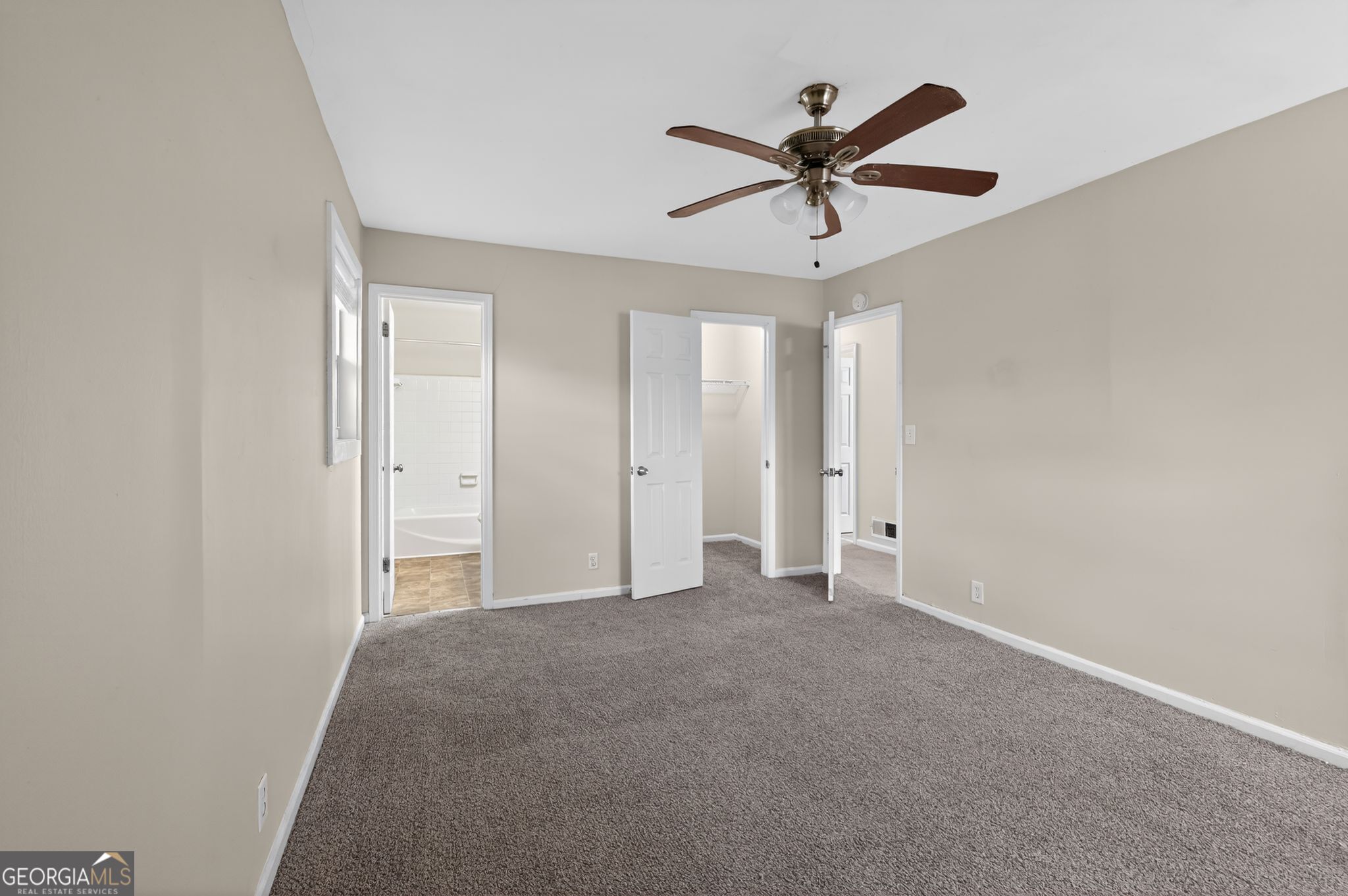 2897 Leisure Woods Lane Decatur, GA 30034 - Photo 19 of 32 a view of a livingroom with a ceiling fan & a ceiling fan