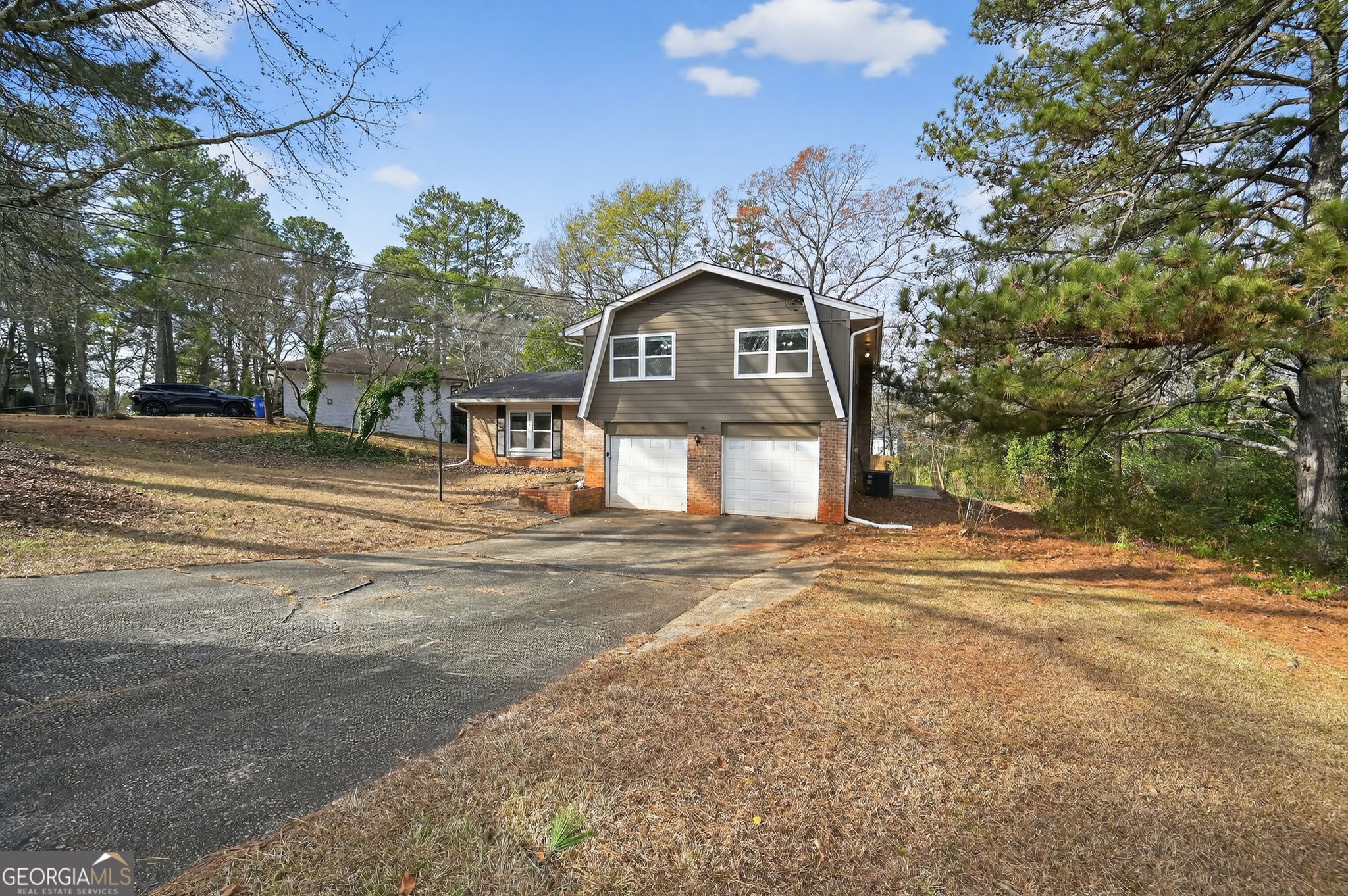 2897 Leisure Woods Lane Decatur, GA 30034 - Photo 2 of 32 a front view of a house with a yard