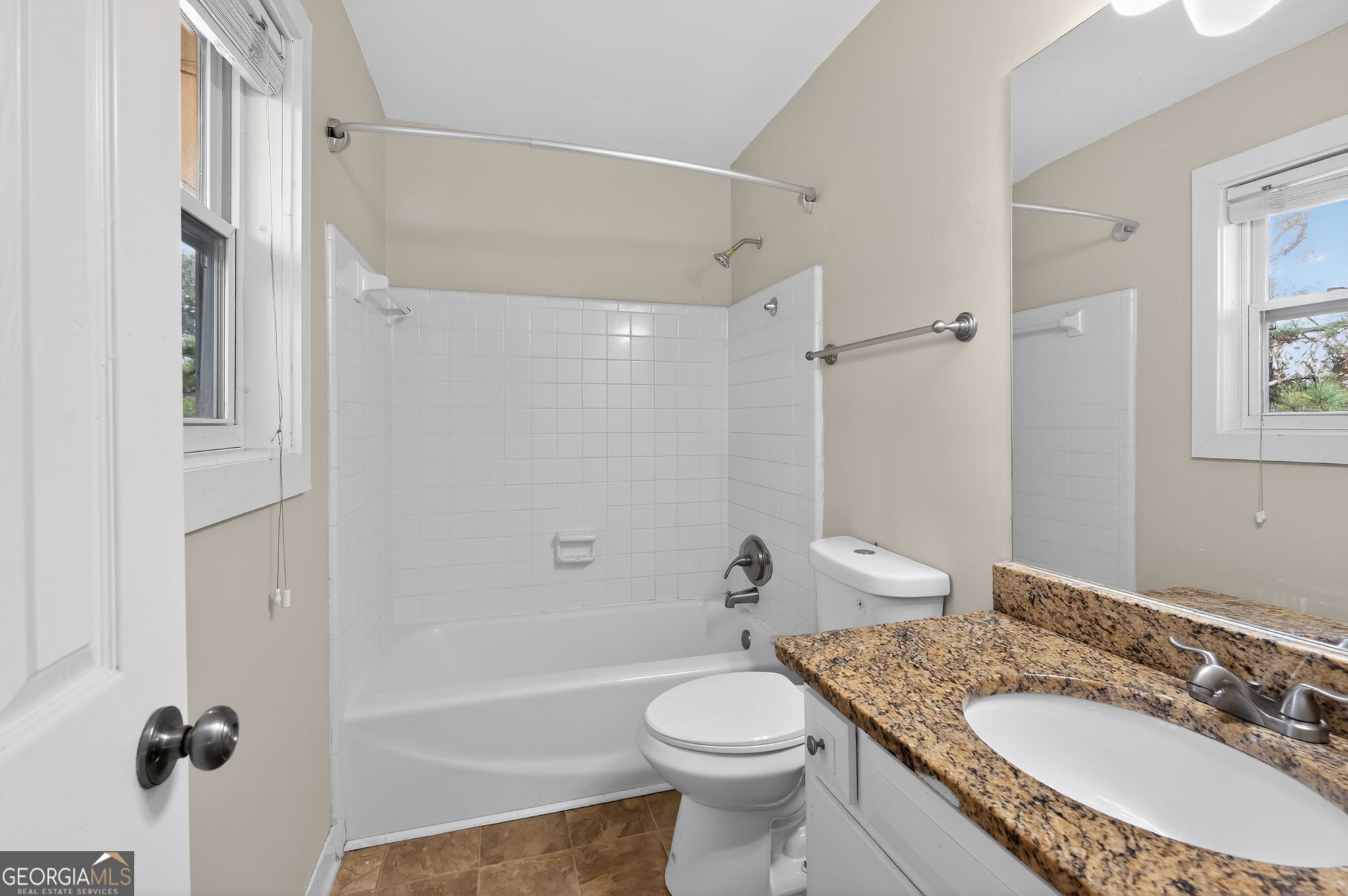 2897 Leisure Woods Lane Decatur, GA 30034 - Photo 21 of 32 a bathroom with a granite countertop sink toilet and shower