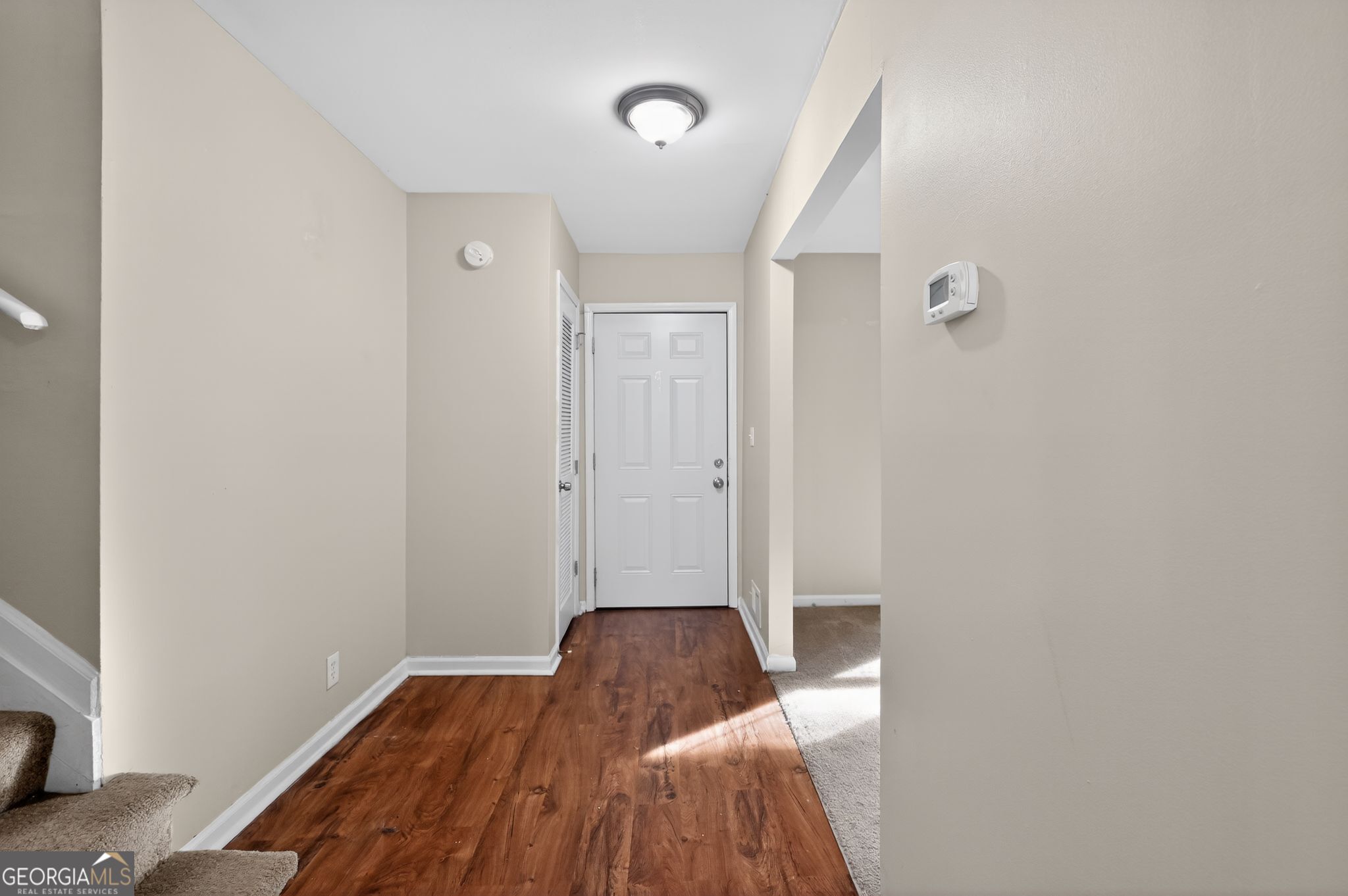 2897 Leisure Woods Lane Decatur, GA 30034 - Photo 24 of 32 a view of a livingroom with wooden floor and bedroom