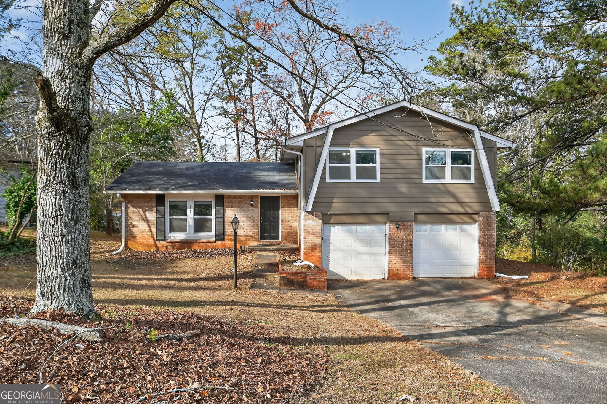 2897 Leisure Woods Lane Decatur, GA 30034 - Photo 3 of 32 a front view of a house with a yard