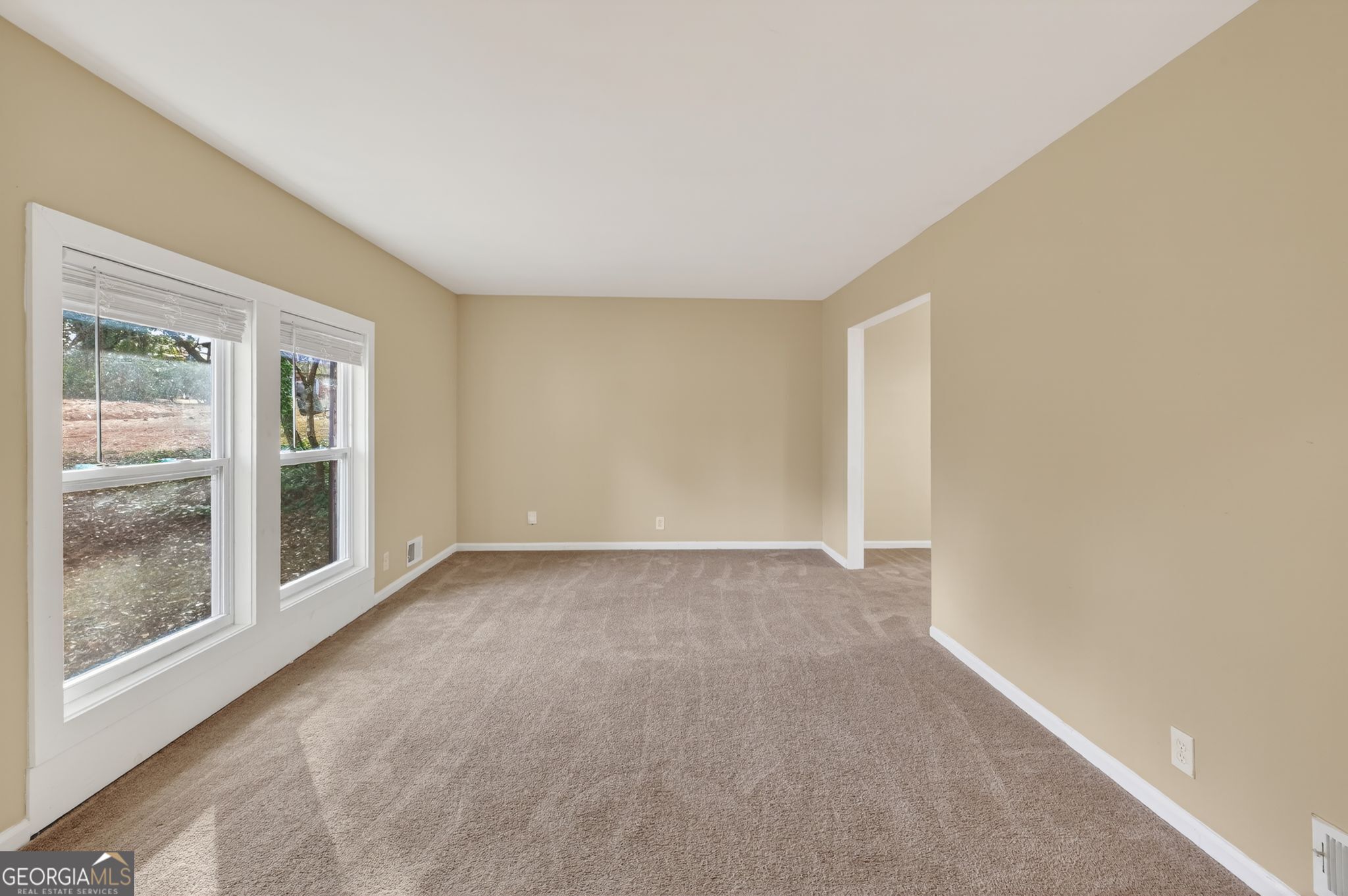 2897 Leisure Woods Lane Decatur, GA 30034 - Photo 4 of 32 a view of an empty room with a window