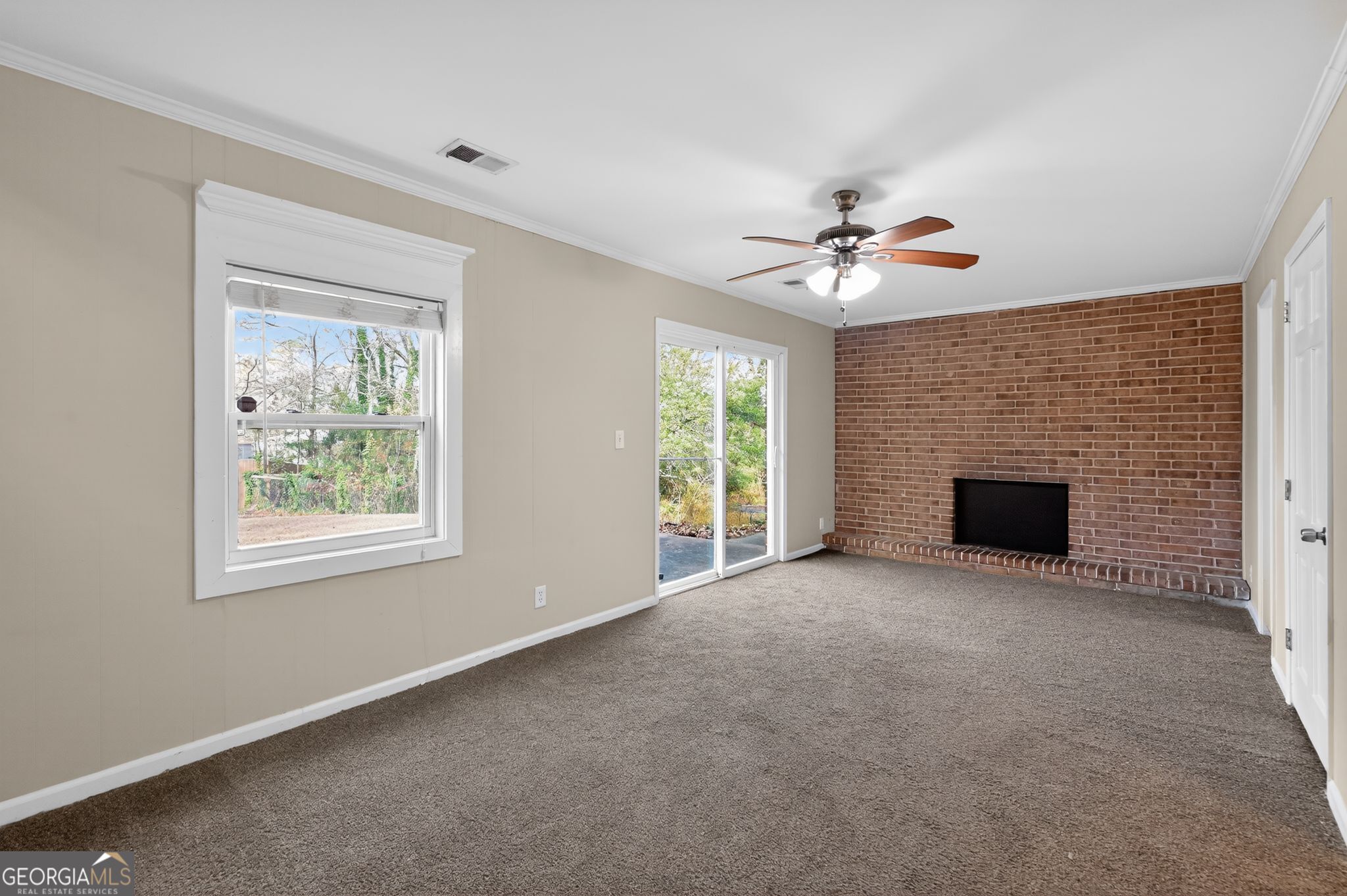 2897 Leisure Woods Lane Decatur, GA 30034 - Photo 9 of 32 an empty room with windows and fireplace
