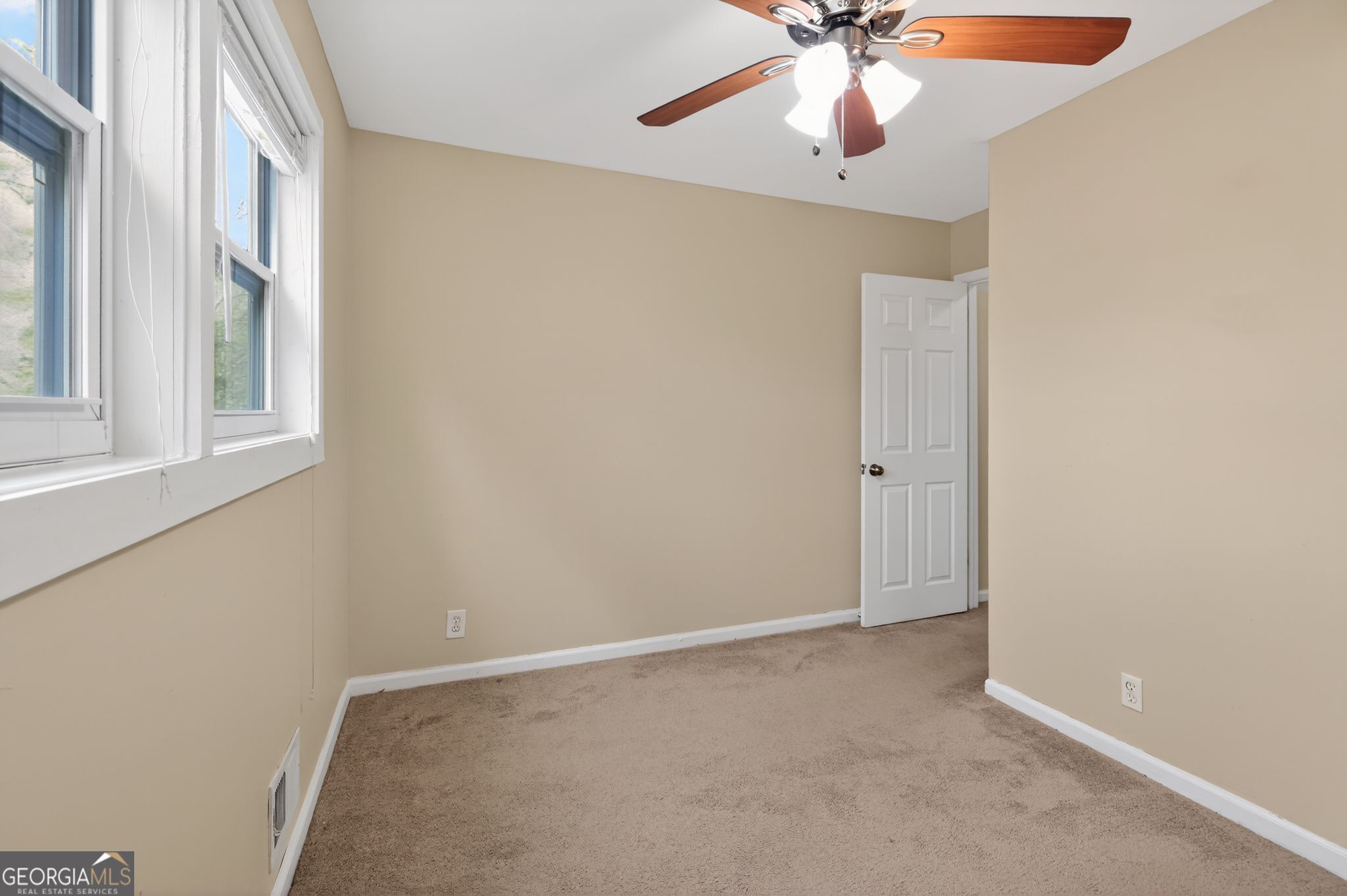 2897 Leisure Woods Lane Decatur, GA 30034 - Photo 10 of 32 wooden floor in an empty room with a window