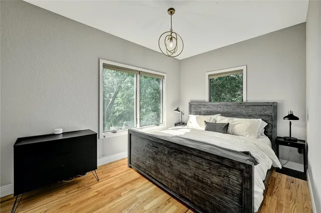 a bed room with a bed and a window