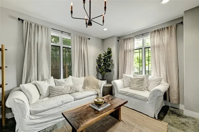 a living room with furniture and a large window