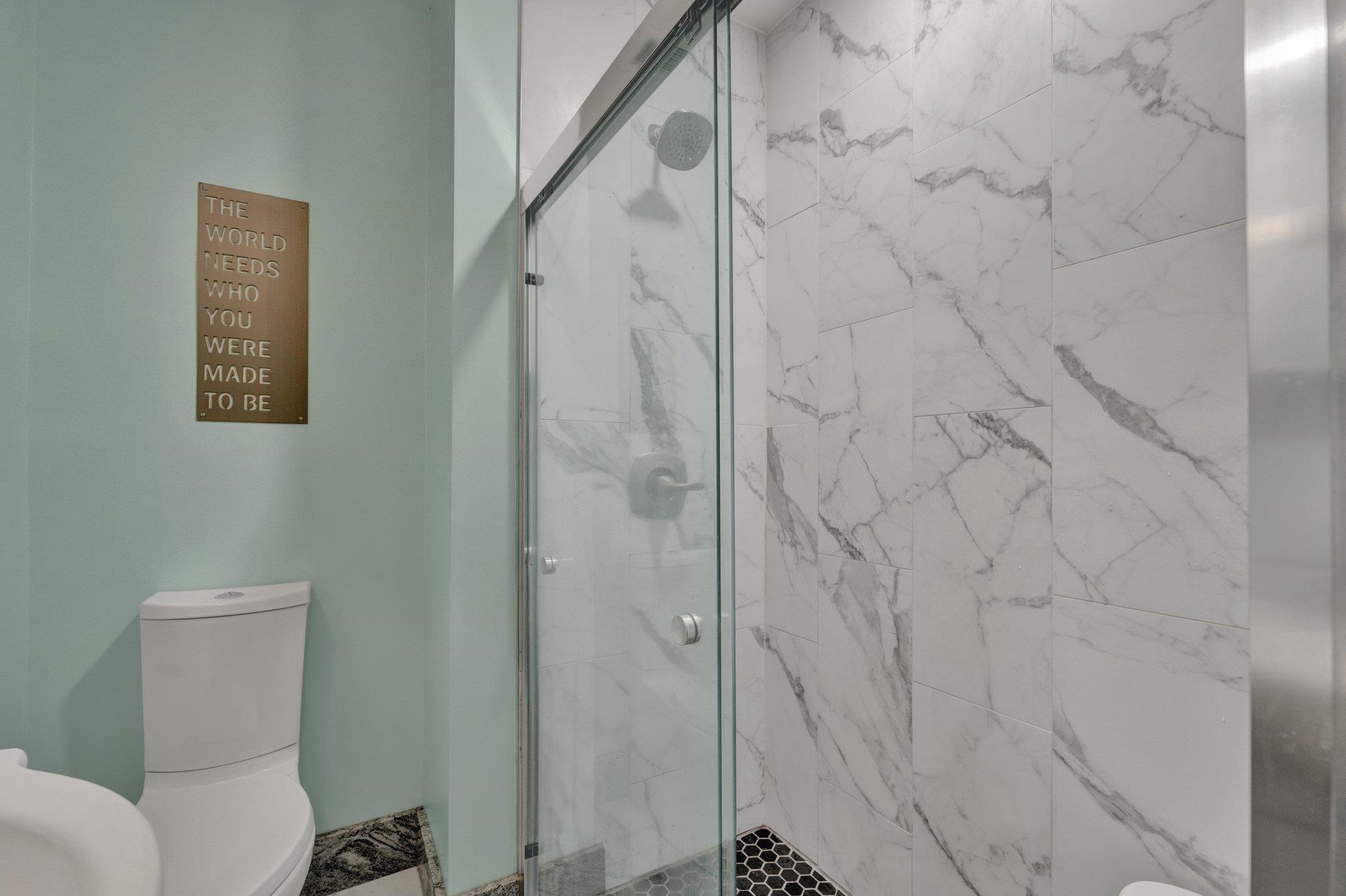 1585 Dearing Road Memphis, TN 38117 - Photo 14 of 34 a bathroom with a toilet and shower