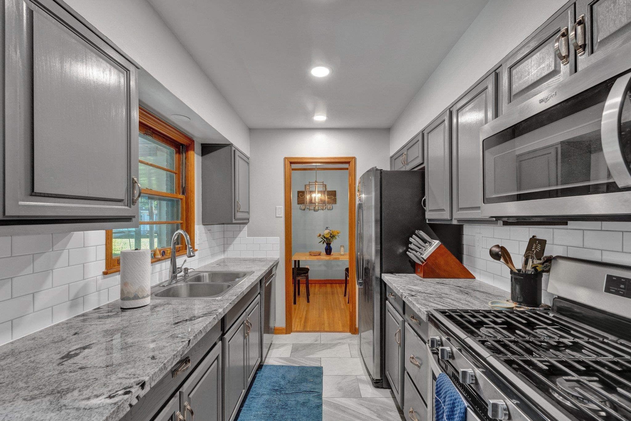 1585 Dearing Road Memphis, TN 38117 - Photo 15 of 34 a kitchen with stainless steel appliances granite countertop a stove and a sink