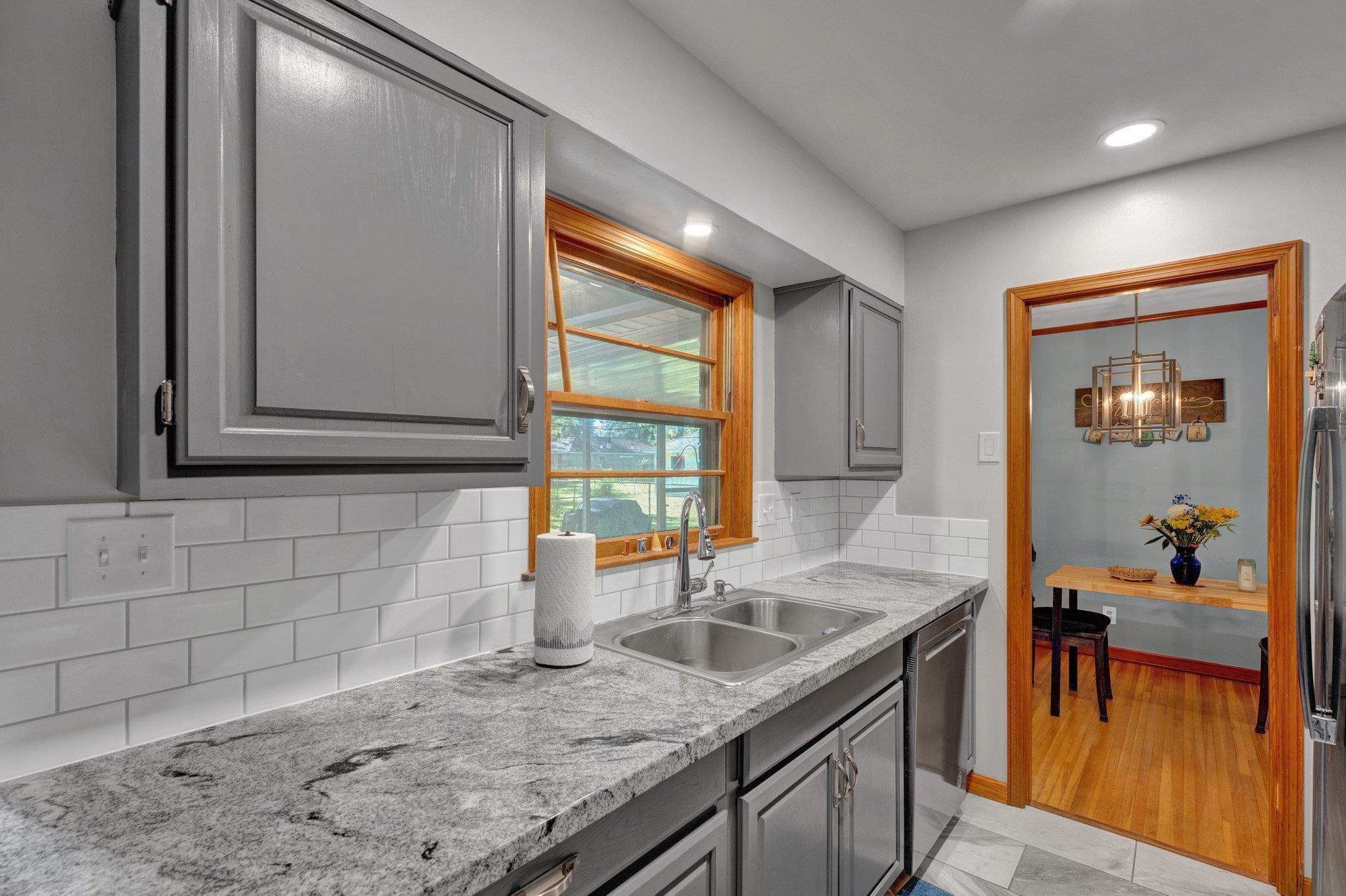 1585 Dearing Road Memphis, TN 38117 - Photo 16 of 34 a kitchen with a sink a counter top space and cabinets