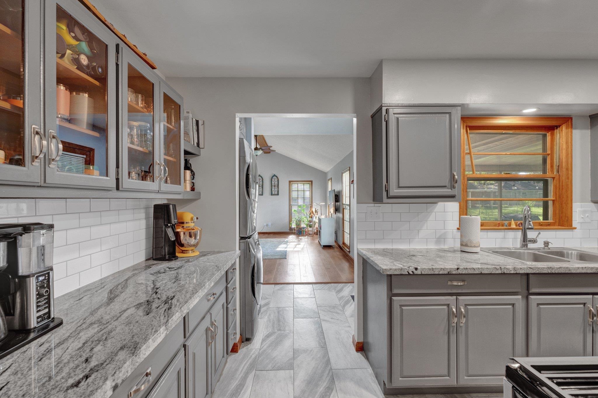 1585 Dearing Road Memphis, TN 38117 - Photo 21 of 34 a kitchen with stainless steel appliances granite countertop a sink stove and cabinets