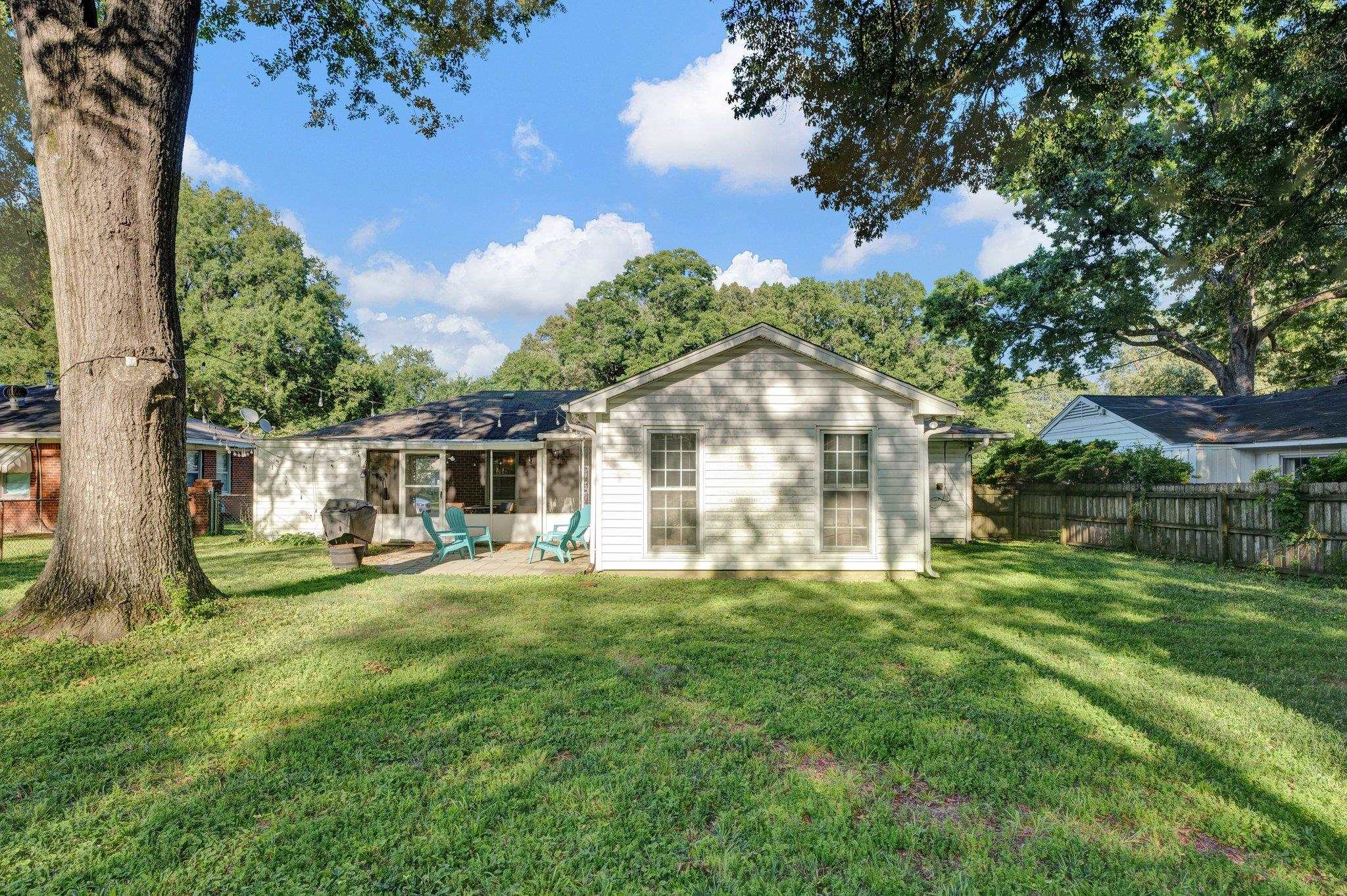 1585 Dearing Road Memphis, TN 38117 - Photo 31 of 34 a view of a house with a big yard and large trees