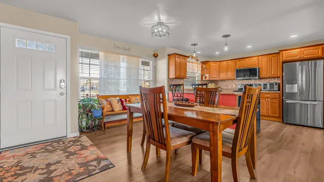 a view of a dining room with furniture window and wooden floor