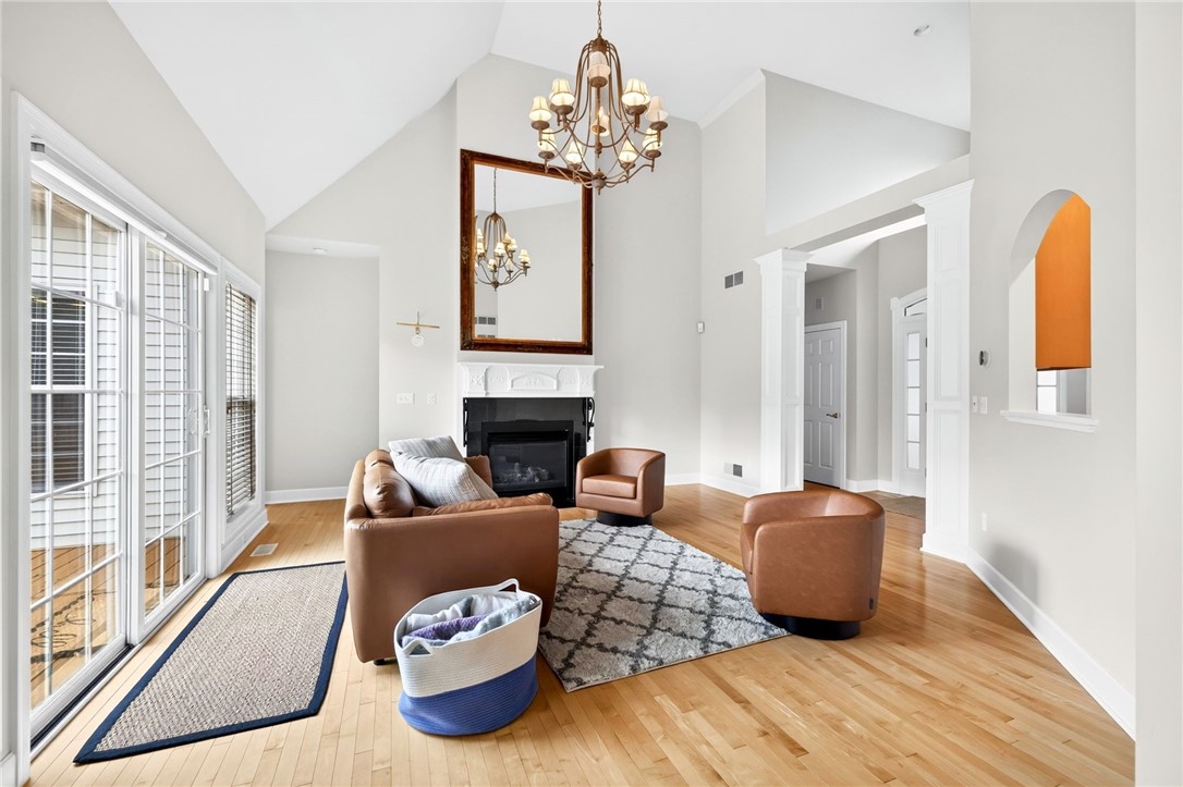 47 New London Road Henrietta, NY 14534 - Photo 2 of 44 Soaring ceilings in the bright living room with ga