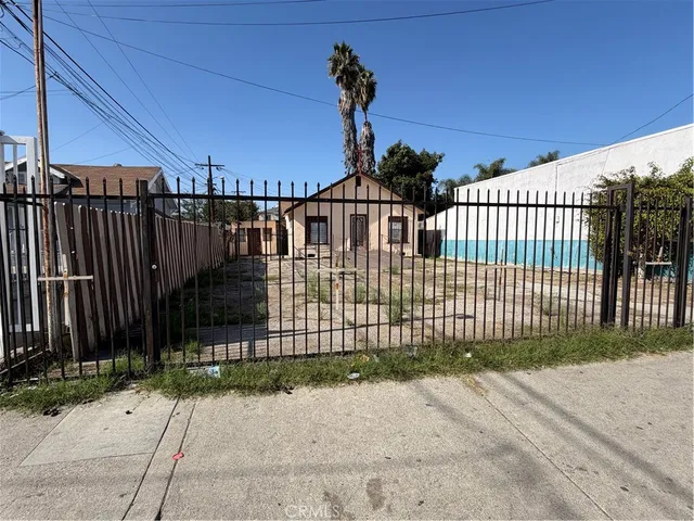 a view of a wrought iron fences in front of house