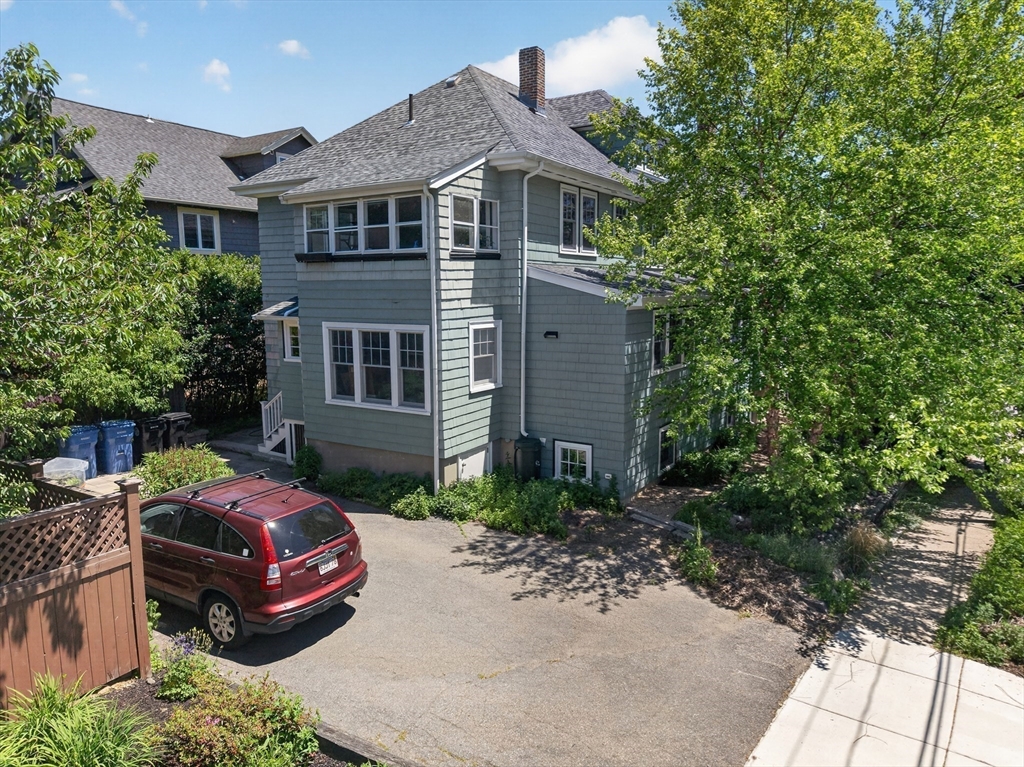 76-78 Lewis Road Belmont, MA 02478 - Photo 34 of 36 a front view of a house with a garden