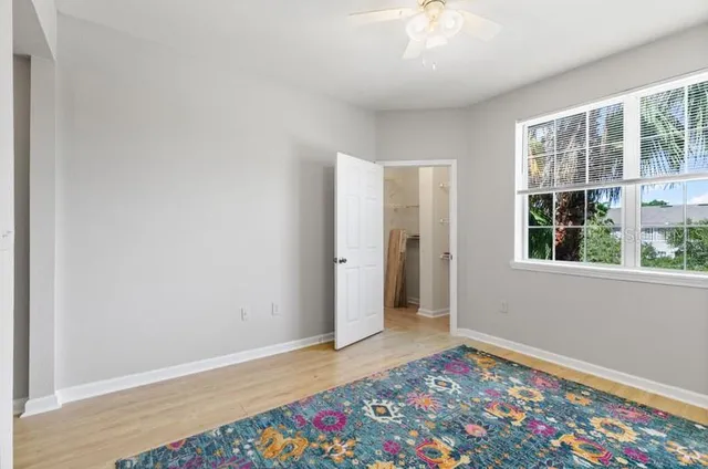 a view of a kitchen with kitchen island and stainless steel appliances