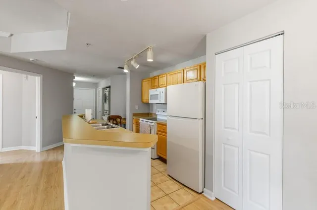 a bathroom with a sink a mirror and a shower