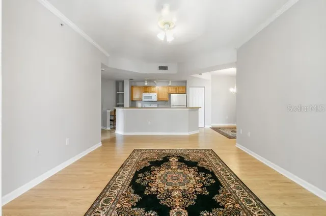 wooden floor in a hall with an empty room