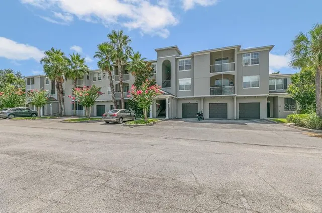 a view of a building with a yard