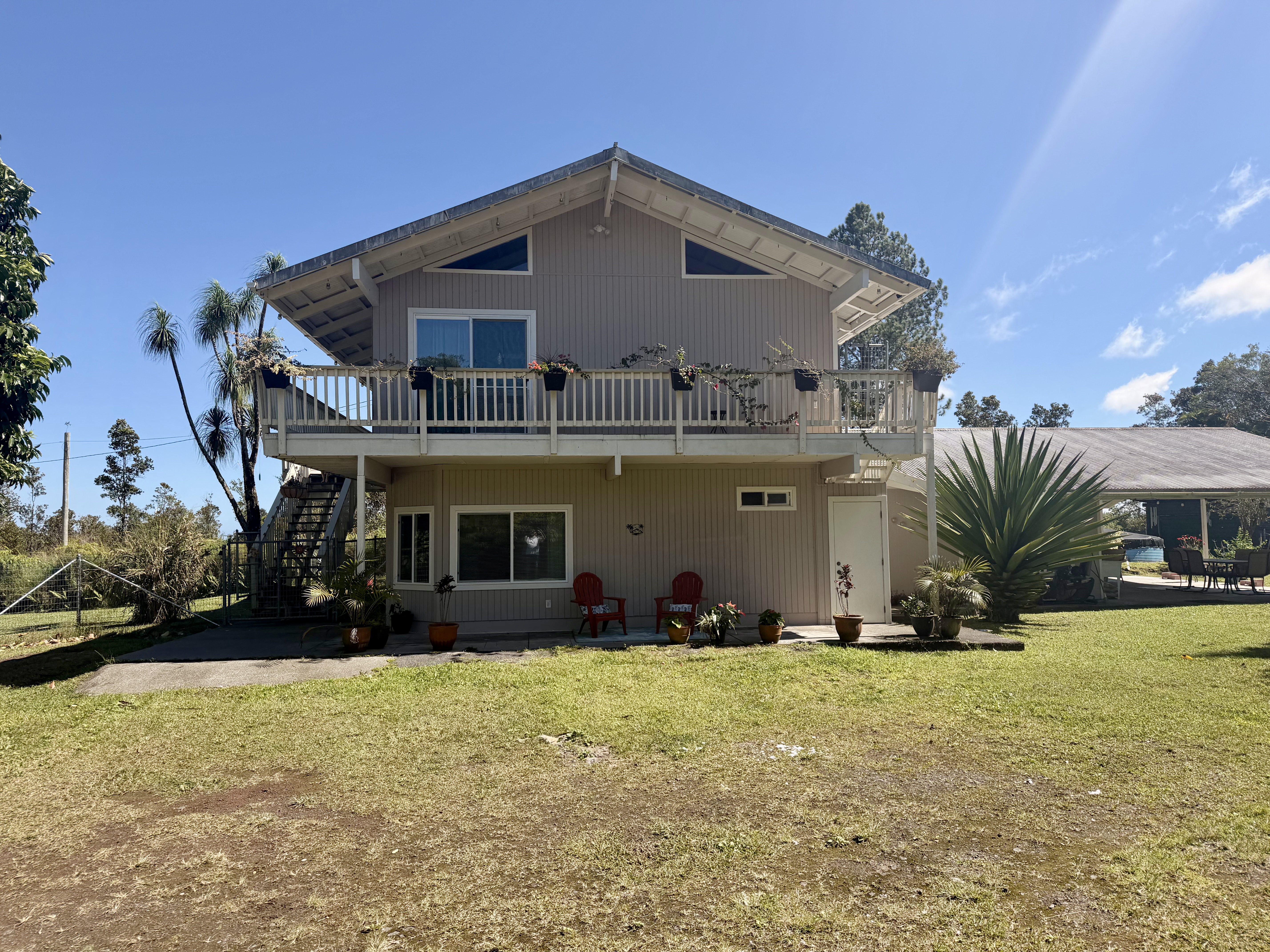 11-2485 Omeka Road Mountain View, HI 96771 - Photo 3 of 30 front view of a house with a yard