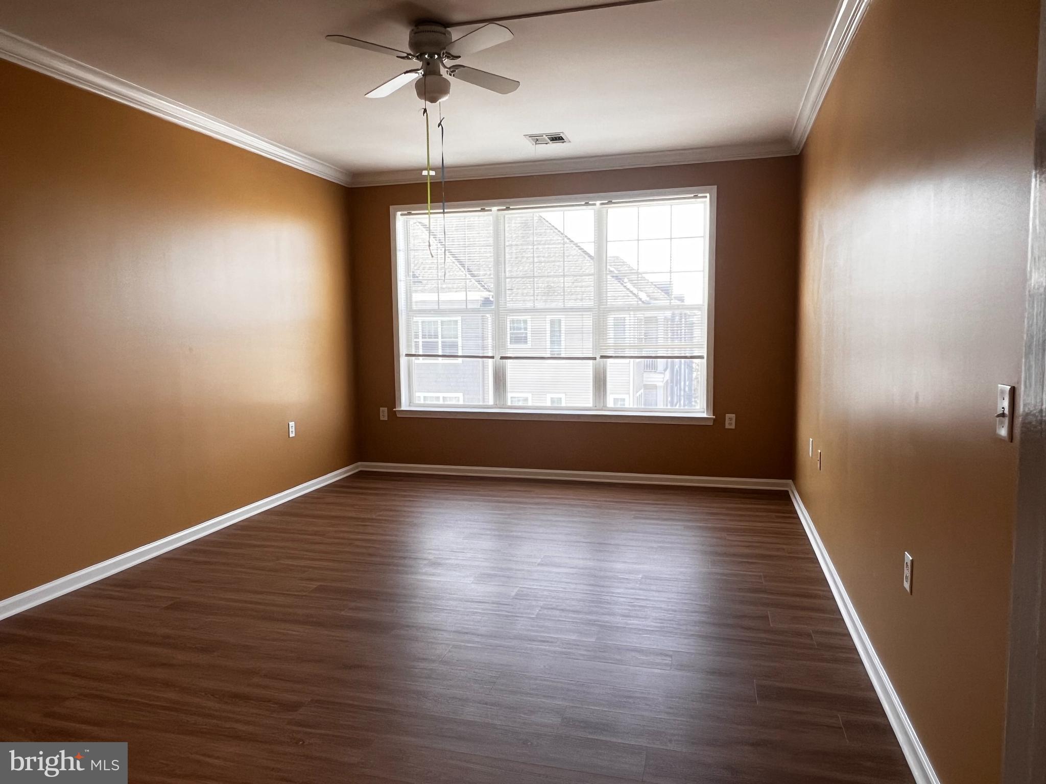245 Masterson Court Ewing, NJ 08618 - Photo 13 of 25 an empty room with wooden floor and windows