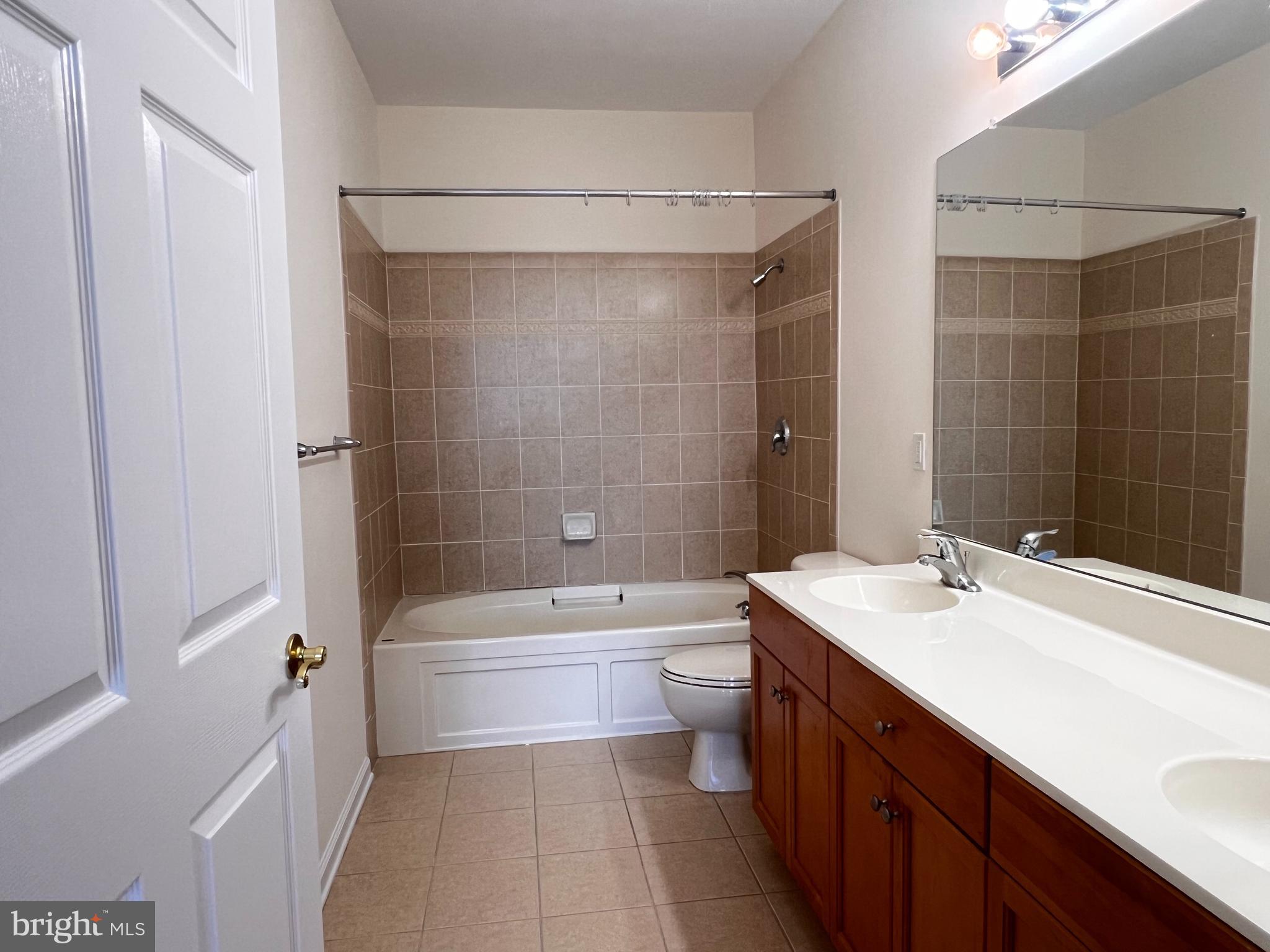 245 Masterson Court Ewing, NJ 08618 - Photo 15 of 25 a bathroom with a sink a toilet and shower