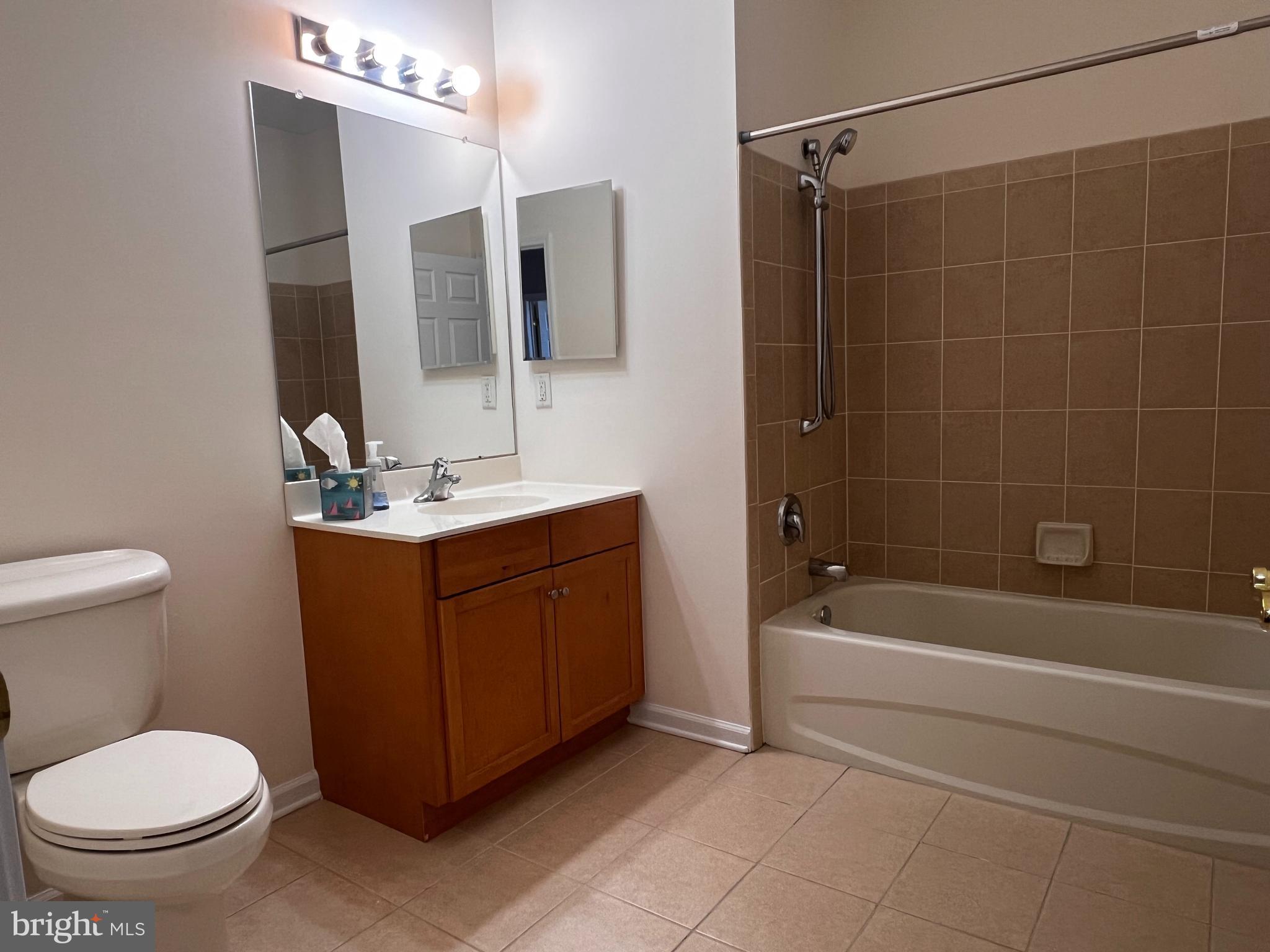 245 Masterson Court Ewing, NJ 08618 - Photo 18 of 25 a bathroom with a sink a toilet and shower