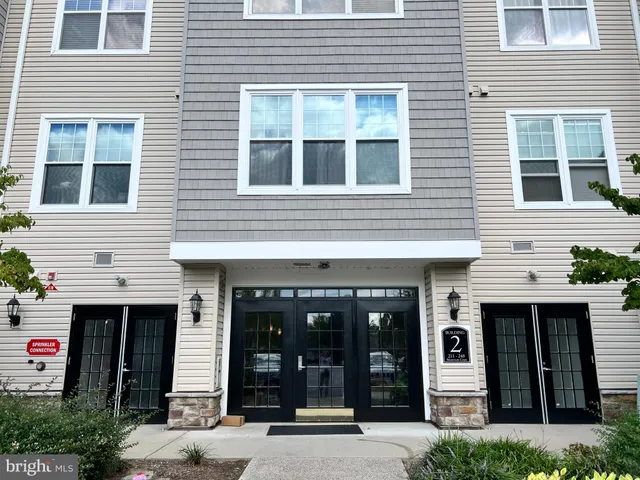 a view of a brick building with large windows