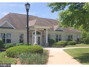 245 Masterson Court Ewing, NJ 08618 - Photo 21 of 25 a front view of a house with garden