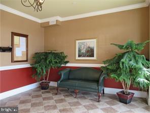 245 Masterson Court Ewing, NJ 08618 - Photo 4 of 21 a living room with furniture potted plant and a window