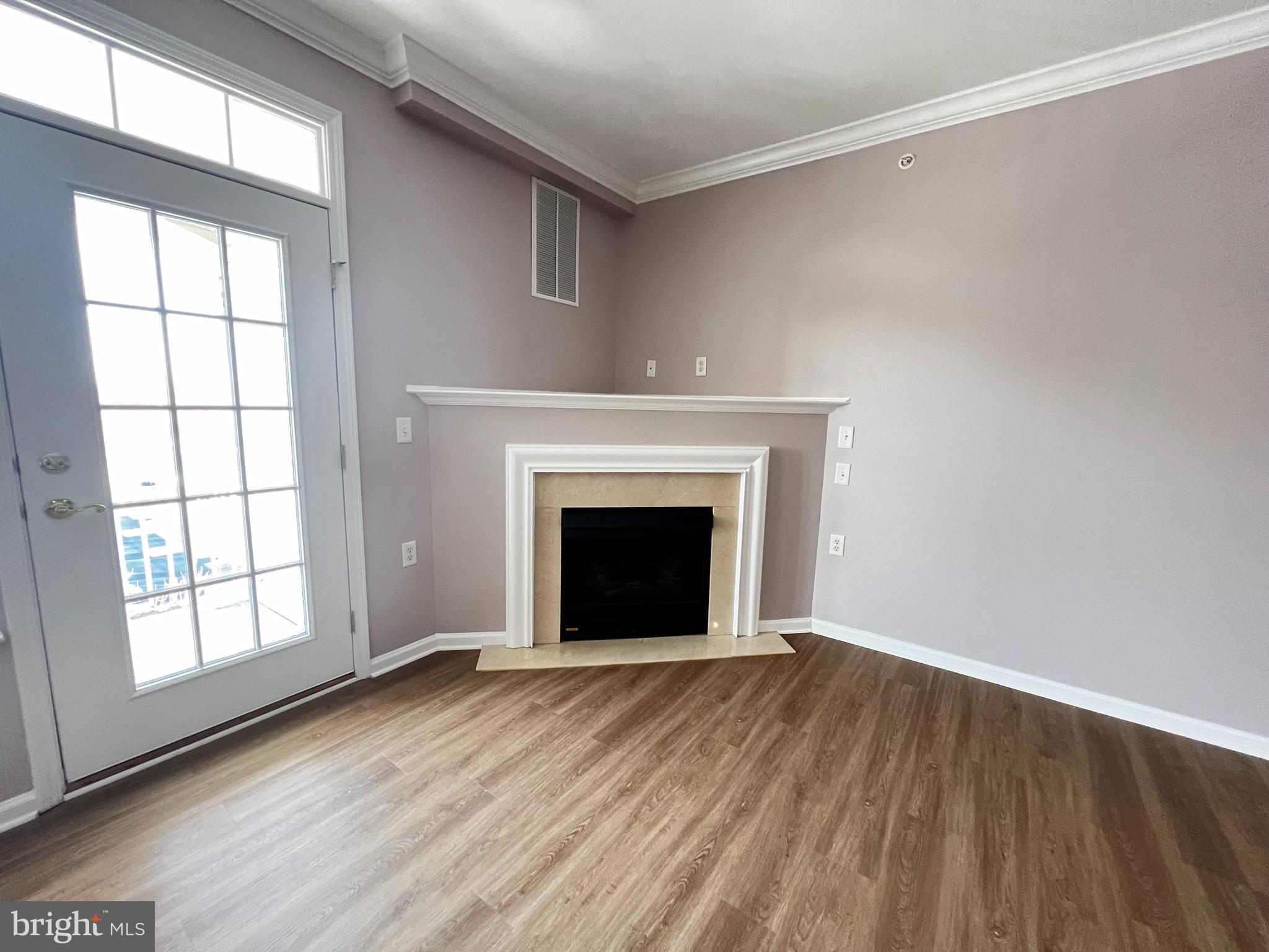245 Masterson Court Ewing, NJ 08618 - Photo 9 of 25 wooden floor fireplace and windows in an empty room