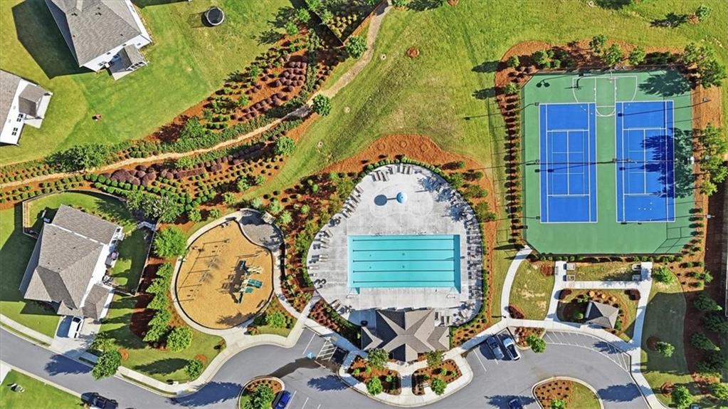 6265 Privet Way Cumming, GA 30028 - Photo 41 of 47 an aerial view of a swimming pool with outdoor seating and yard