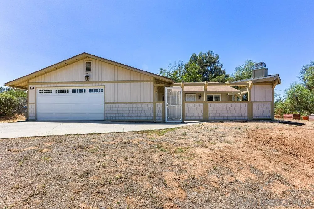 714 Steffy Road Ramona, CA 92065 - Photo 1 of 25 a front view of a house with a yard and garage