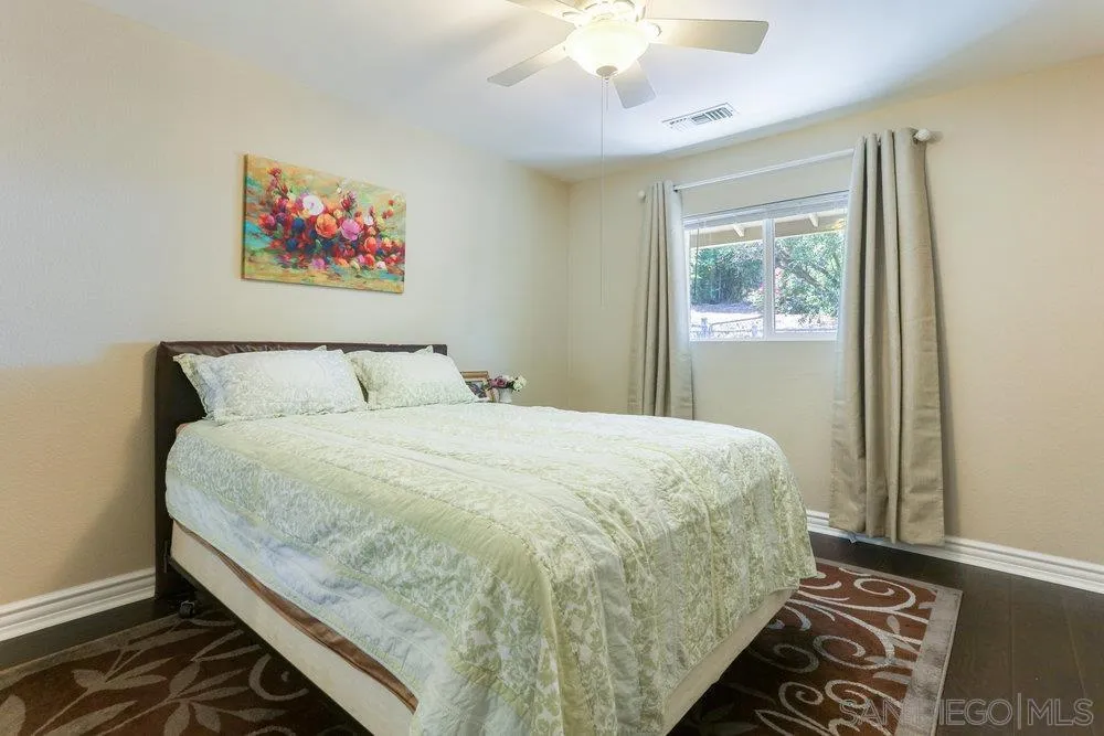714 Steffy Road Ramona, CA 92065 - Photo 15 of 25 a large bed sitting in a bedroom next to a window