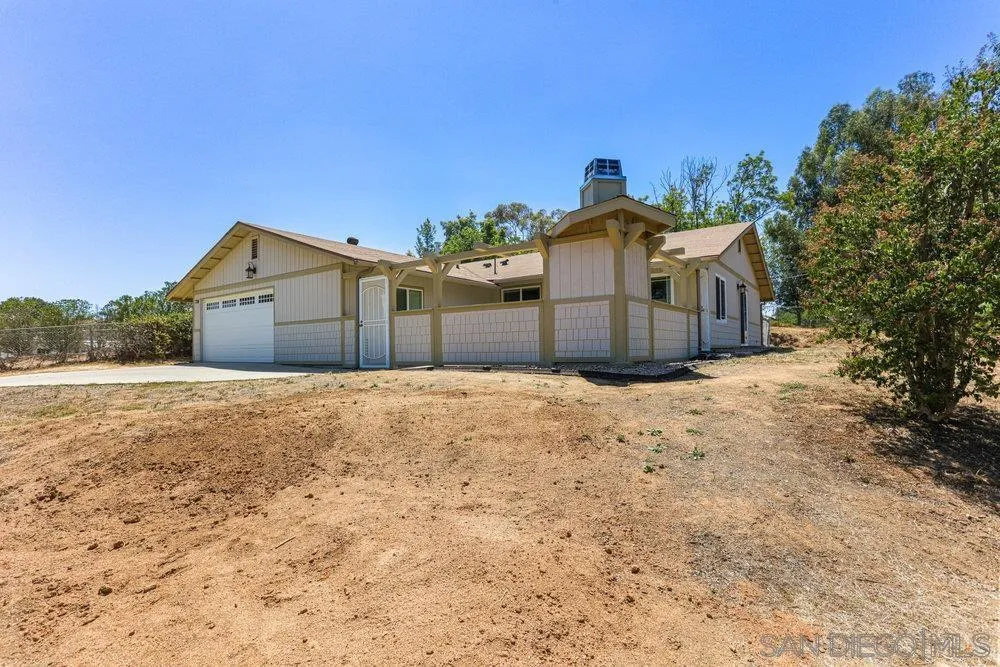 714 Steffy Road Ramona, CA 92065 - Photo 2 of 25 a front view of a house with a yard and garage