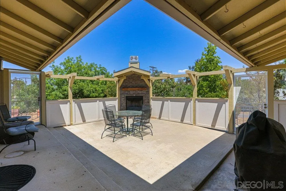 714 Steffy Road Ramona, CA 92065 - Photo 6 of 25 a view of a patio with a table chairs and a table