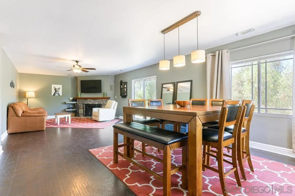 714 Steffy Road Ramona, CA 92065 - Photo 7 of 25 a view of a dining room with furniture window and wooden floor