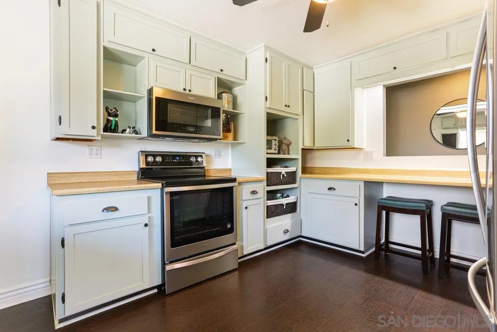 714 Steffy Road Ramona, CA 92065 - Photo 10 of 25 a kitchen with a sink stove and microwave